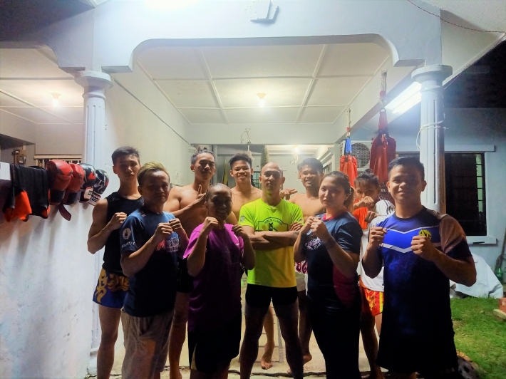 The trainers with their student. Because of the limited and small training ground, number of muay thai students also limited. 